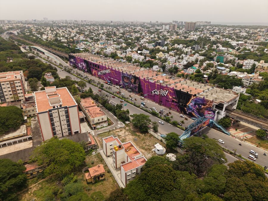 Drone view of the finished Campa Energy mural along the Indira Nagar MRTS wall, Chennai